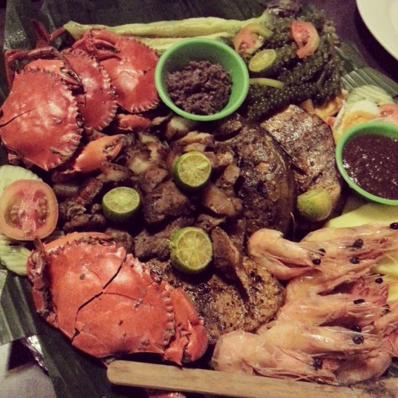 (Clockwise from top left): Crabs, lato, shrimp, fish buried under pork.