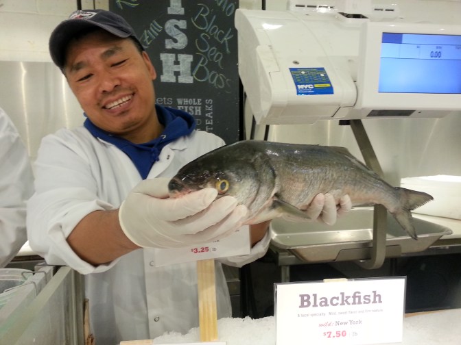 The fishmonger insisted the fish be smiling for the picture